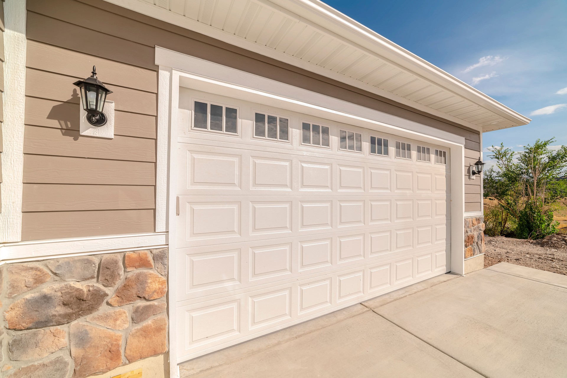 Double garage of modern home on sunny, clear day