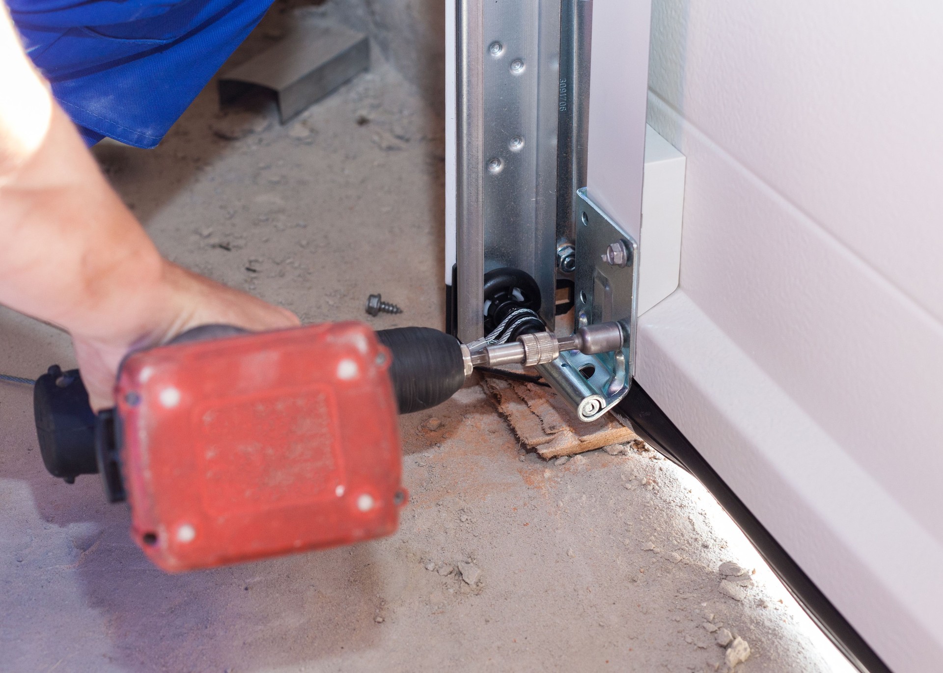 Professional worker install garage doors at new house